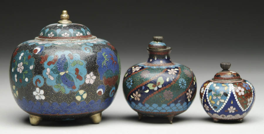 Appraisal: THREE FOOTED ROUND COVERED CLOISONN JARS h with black ground