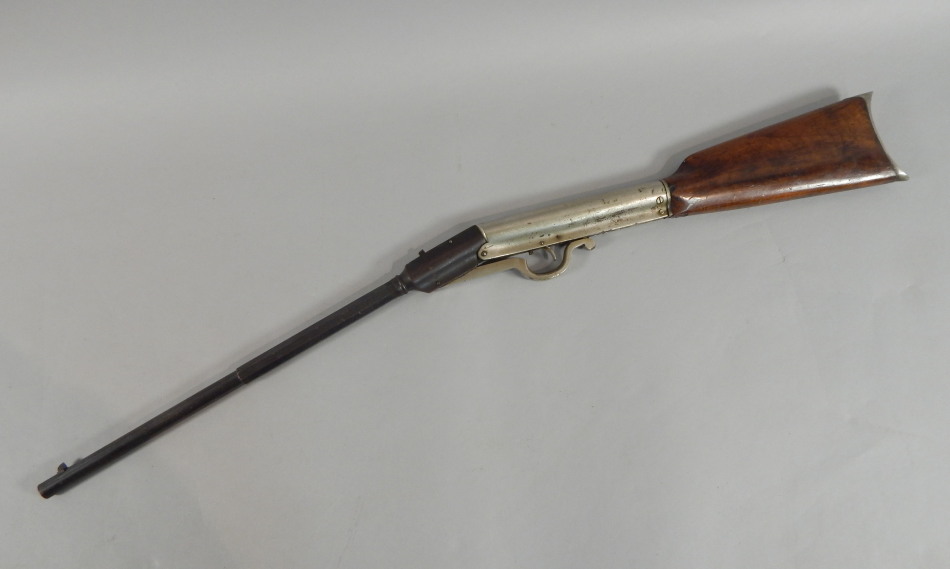 Appraisal: An air rifle with walnut stock and silvered metal action