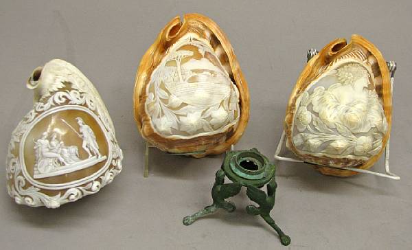 Appraisal: Three Italian cameo conch shells and one verdigris patinated bronze