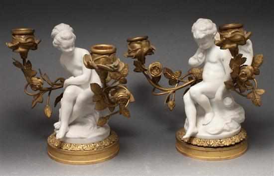 Appraisal: Pair of French figural bisque bronze dore-mounted two-light candelabra candelabra