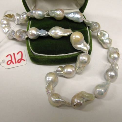 Appraisal: BAROQUE PEARL NECKLACE strung with free form white pearls with