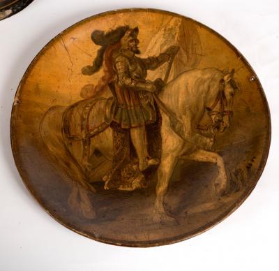 Appraisal: A papier-m ch charger decorated a knight on horseback cm