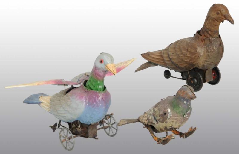 Appraisal: Lot of Tin Hand-Painted Pigeon Wind-Up Toys Description German Working