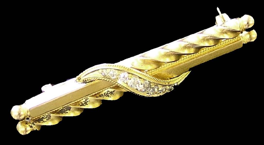 Appraisal: ct twist design bar brooch set with nine small diamonds