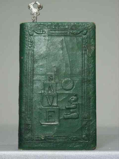 Appraisal: Figural book cast iron still bank Faux green leather over