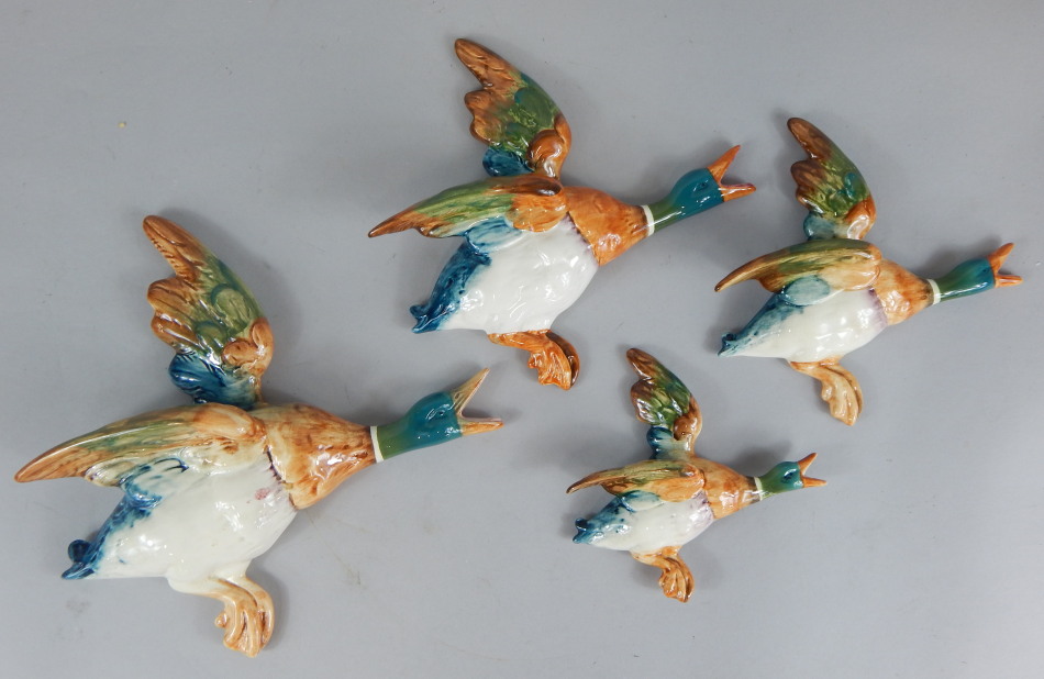 Appraisal: A flight of four Beswick wall mounted mallard ducks the