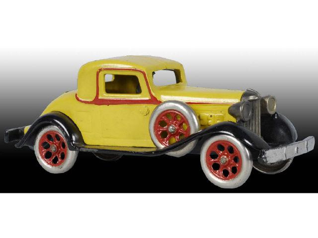 Appraisal: Cast Iron Arcade REO Coupe Toy Car Description Yellow and