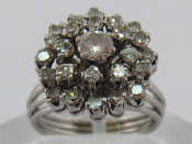 Appraisal: A white metal tests carat gold diamond cluster ring the