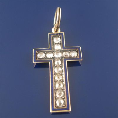 Appraisal: A gold cruciform pendant set with thirteen rose cut diamonds