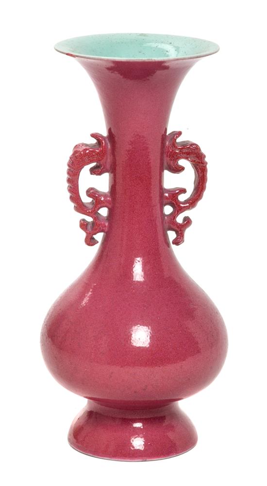 Appraisal: Sale Lot A Ruby Red Glazed Porcelain Vase flanked by