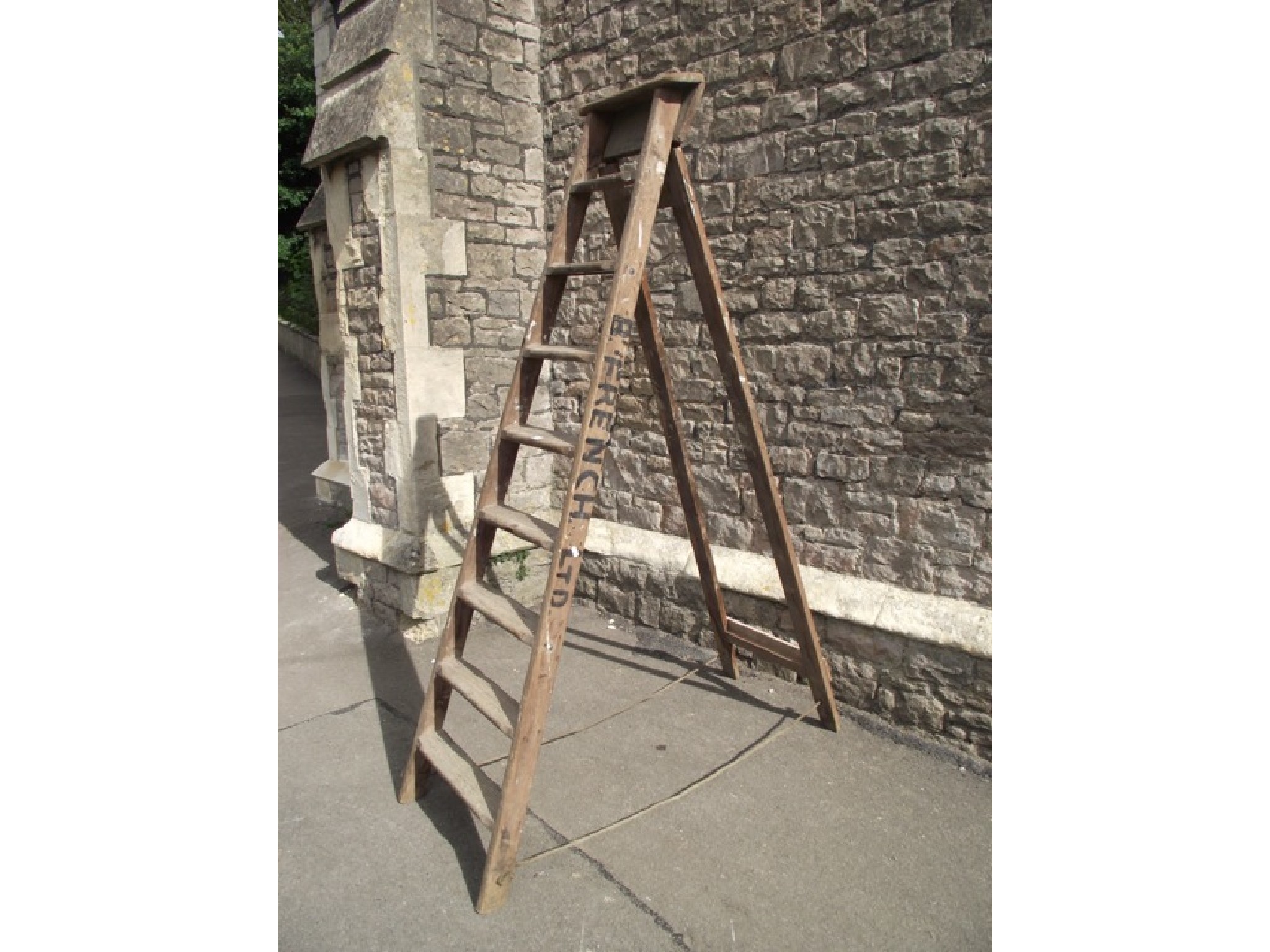 Appraisal: A vintage eight rung A framed folding wooden step ladder