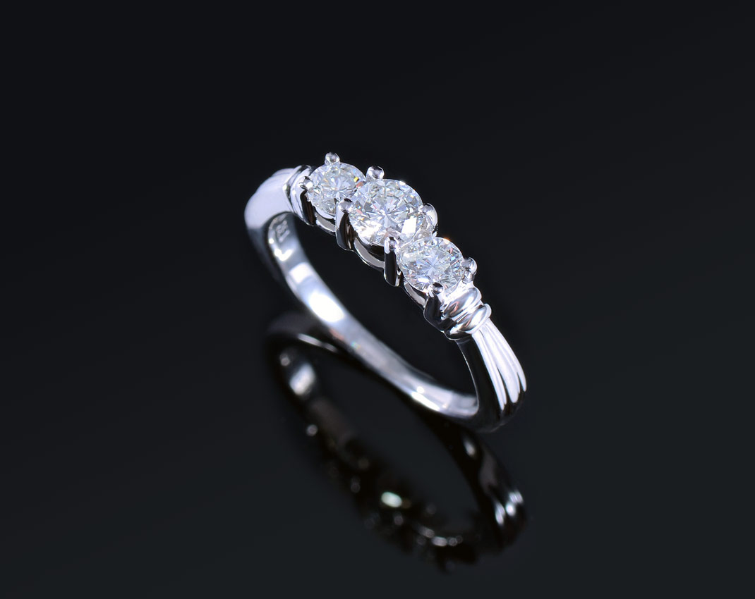 Appraisal: PLATINUM STONE DIAMOND ENGAGEMENT RING Three round brilliant diamonds totaling