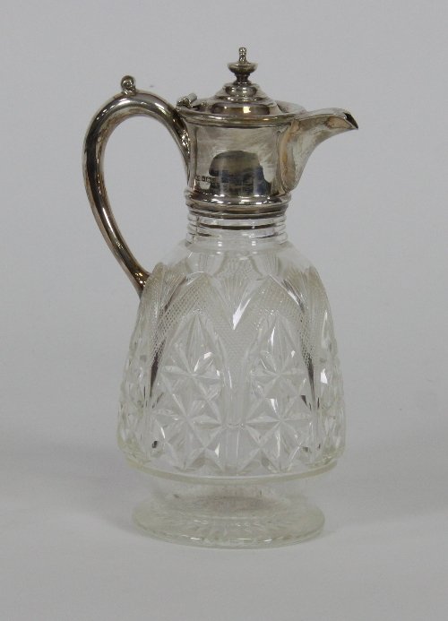 Appraisal: A cut glass claret jug the silver mounts Sheffield on