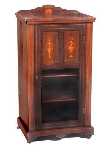 Appraisal: A rosewood and satinwood inlaid cabinet with glazed door standing