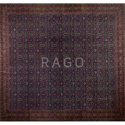 Appraisal: HAND-TIED ORIENTAL RUG All over floral design navy blue ground