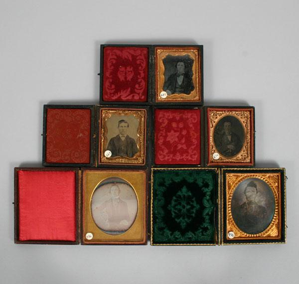 Appraisal: Five leather daguerreotype cases including images of young men Tallest