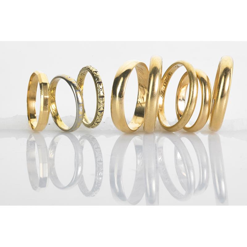 Appraisal: EIGHT K YELLOW GOLD BANDS INCLUDES CARTIER Condition Report