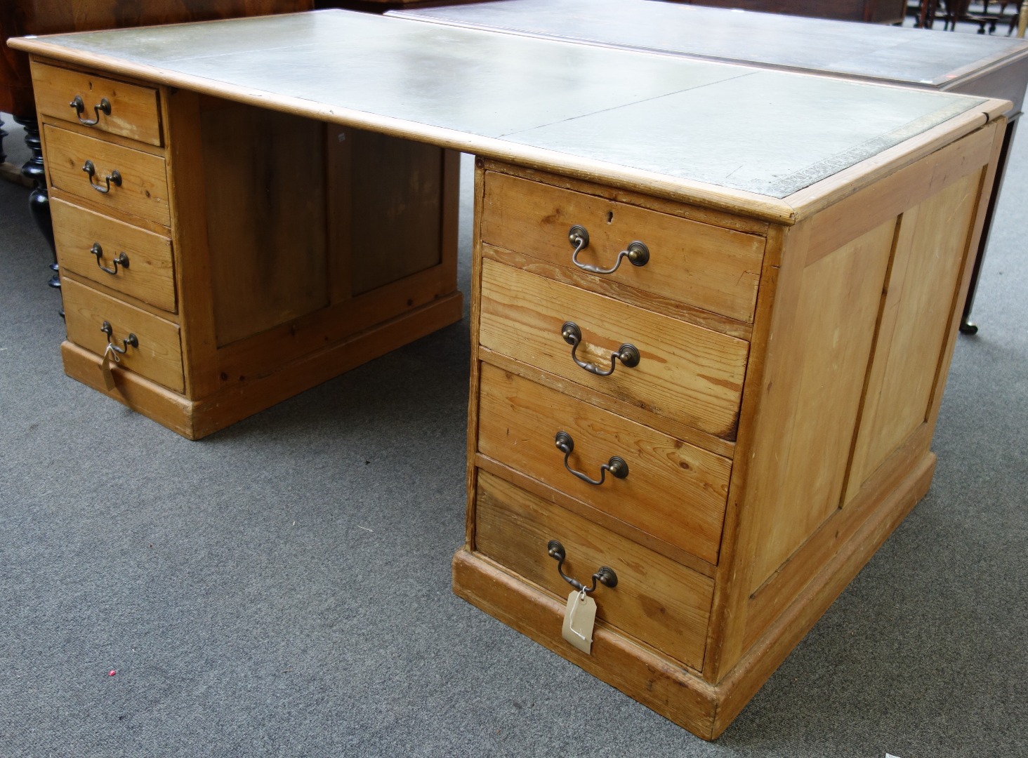 Appraisal: A pine pedestal desk each pedestal with four graduated drawers