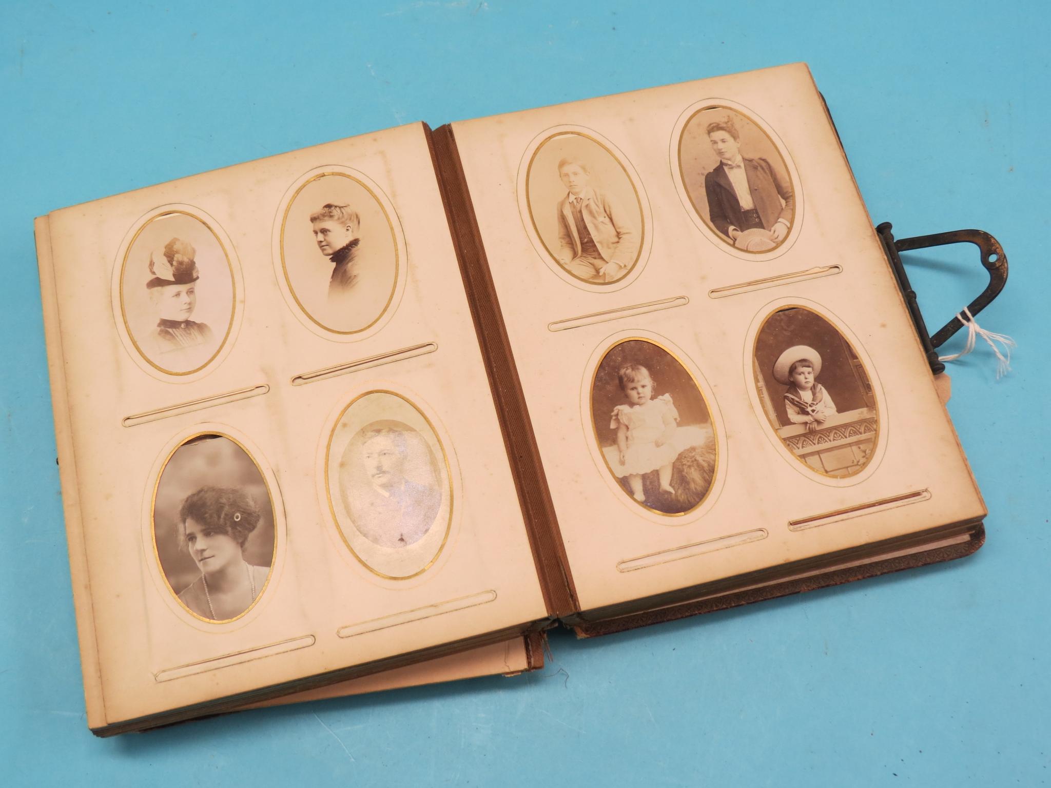 Appraisal: A Victorian family portrait photograph album binding considerably worn