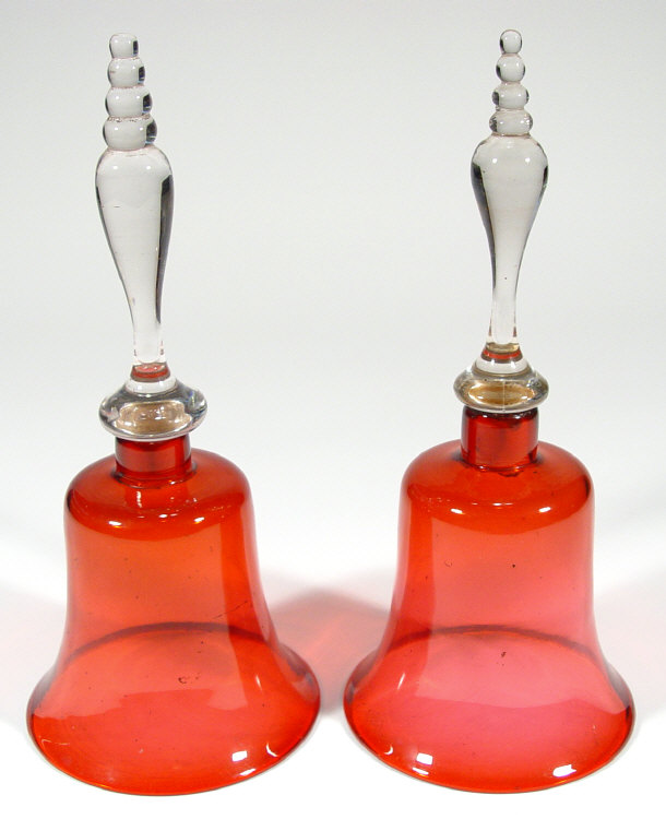 Appraisal: Pair of Victorian cranberry glass hand bells with turned handles