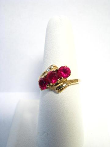 Appraisal: Lady's K yellow gold ruby ring with three round cut