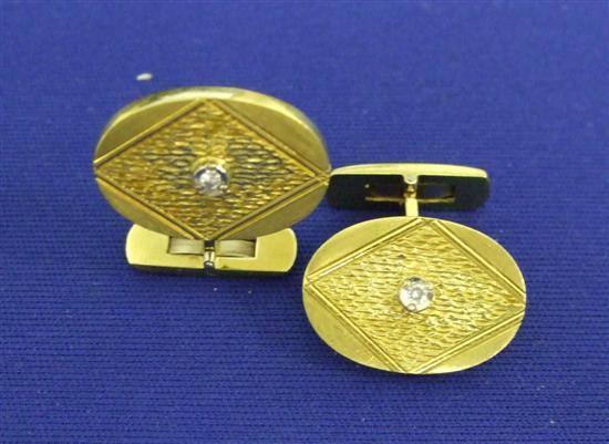 Appraisal: Gold diamond set cuff links in polished and textured gold