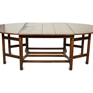 Appraisal: An English Oak Gate-Leg Dining Table th Century Height x