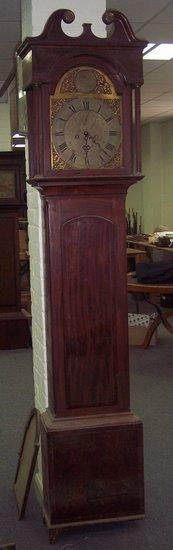 Appraisal: A mahogany cased eight-day longcase clock the hood with broken