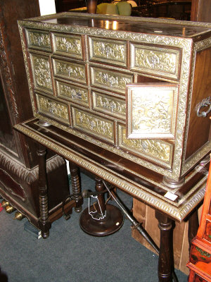 Appraisal: A Spanish walnut vangueno on stand th century the upper