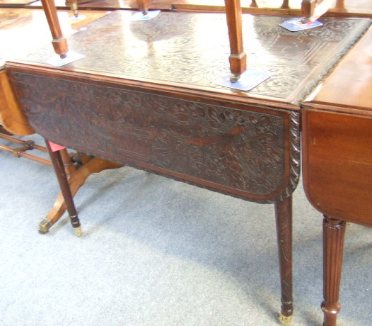 Appraisal: A George III mahogany and later carved Pembroke table the