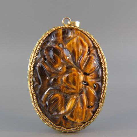 Appraisal: Chinese Carved Tigerseye Pendant floral design in fancy gold on