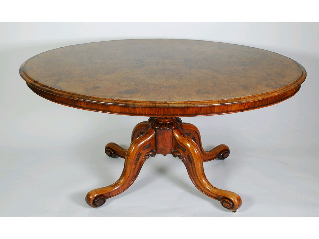 Appraisal: A MID VICTORIAN FIGURED WALNUT PEDESTAL BREAKFAST TABLE the quarter