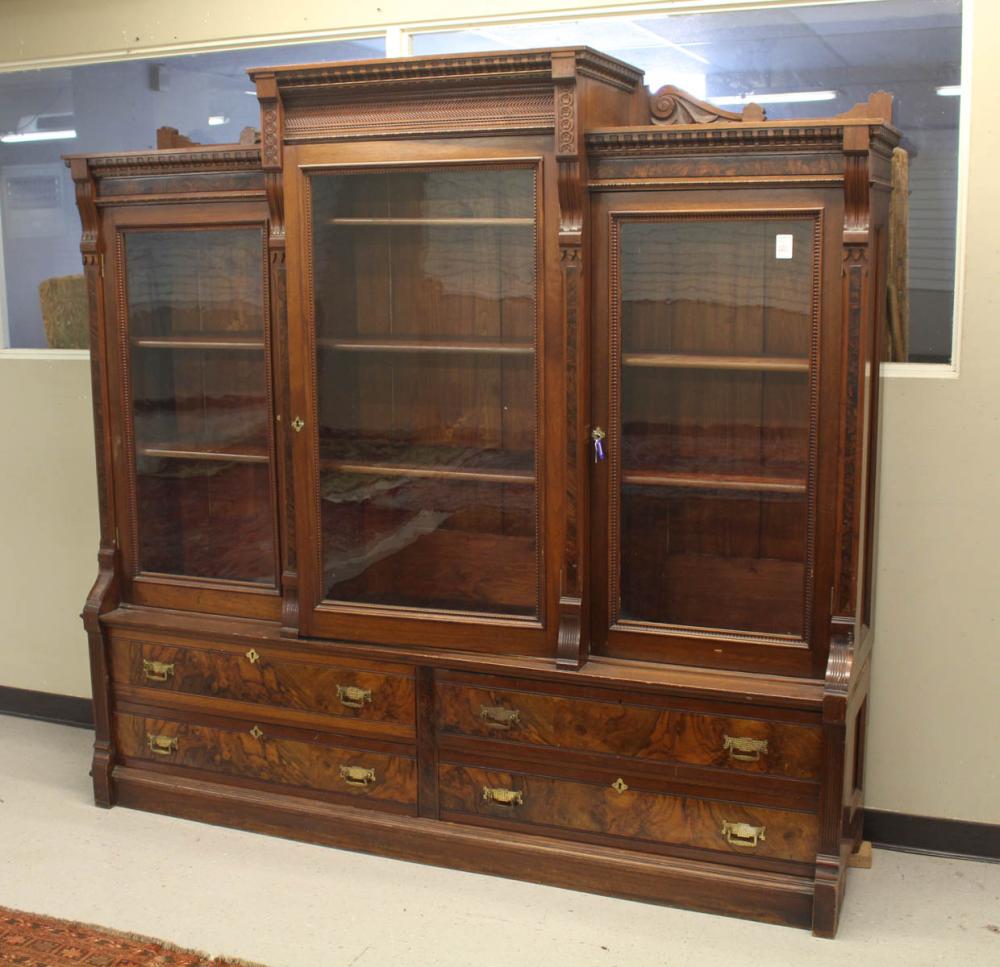 Appraisal: VICTORIAN WALNUT BREAKFRONT CABINET BOOKCASE ON CHEST Renaissance Revival design