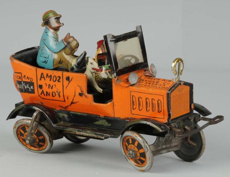 Appraisal: Marx Tin Amos N Andy Taxi Toy Description Complete with