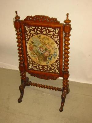 Appraisal: A VICTORIAN CARVED WALNUT FRAMED FIRESCREEN of oblong form with