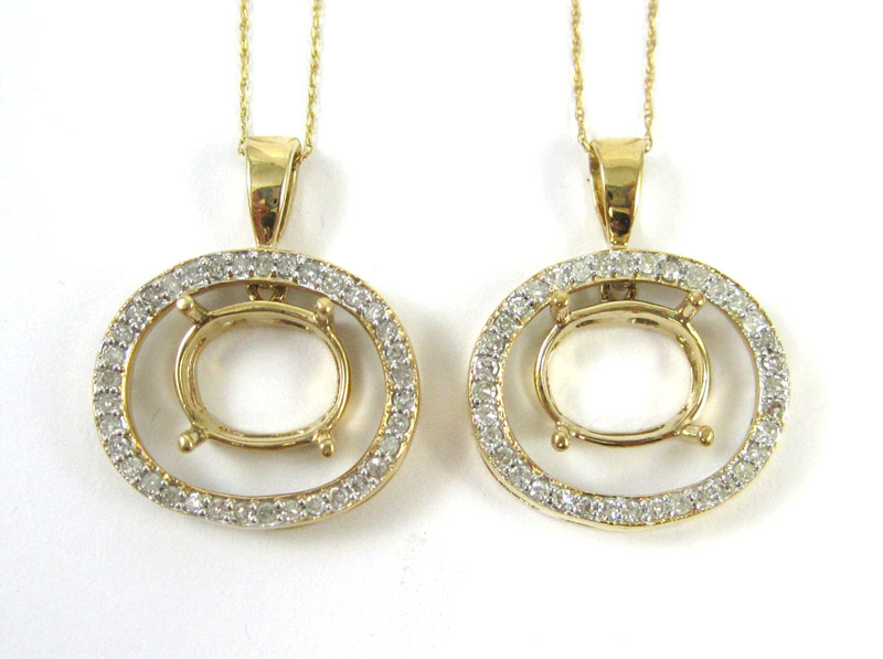 Appraisal: TWO TEN KARAT GOLD PENDANT NECKLACE SETTINGS each having a