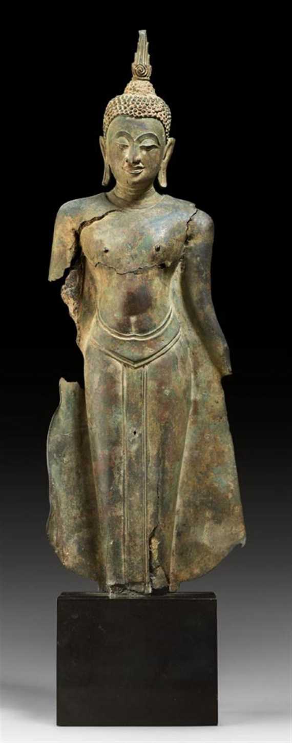 Appraisal: A BRONZE STANDING BUDDHA WITH VERY SENSITIVE EXPRESSION Thailand Ayutthaya