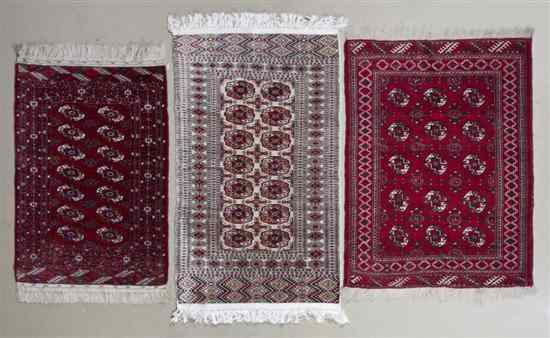 Appraisal: Three Bokhara Wool Mats each with repeating geometric medallions Length