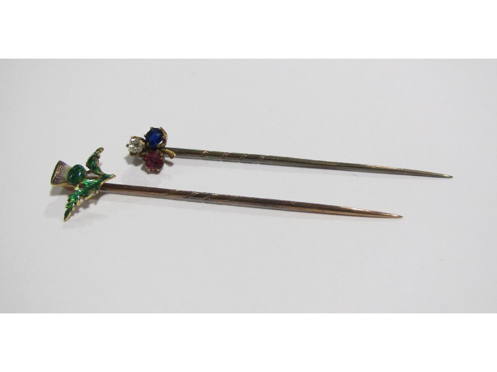 Appraisal: A shamrock topped stick pin set with diamond ruby sapphire