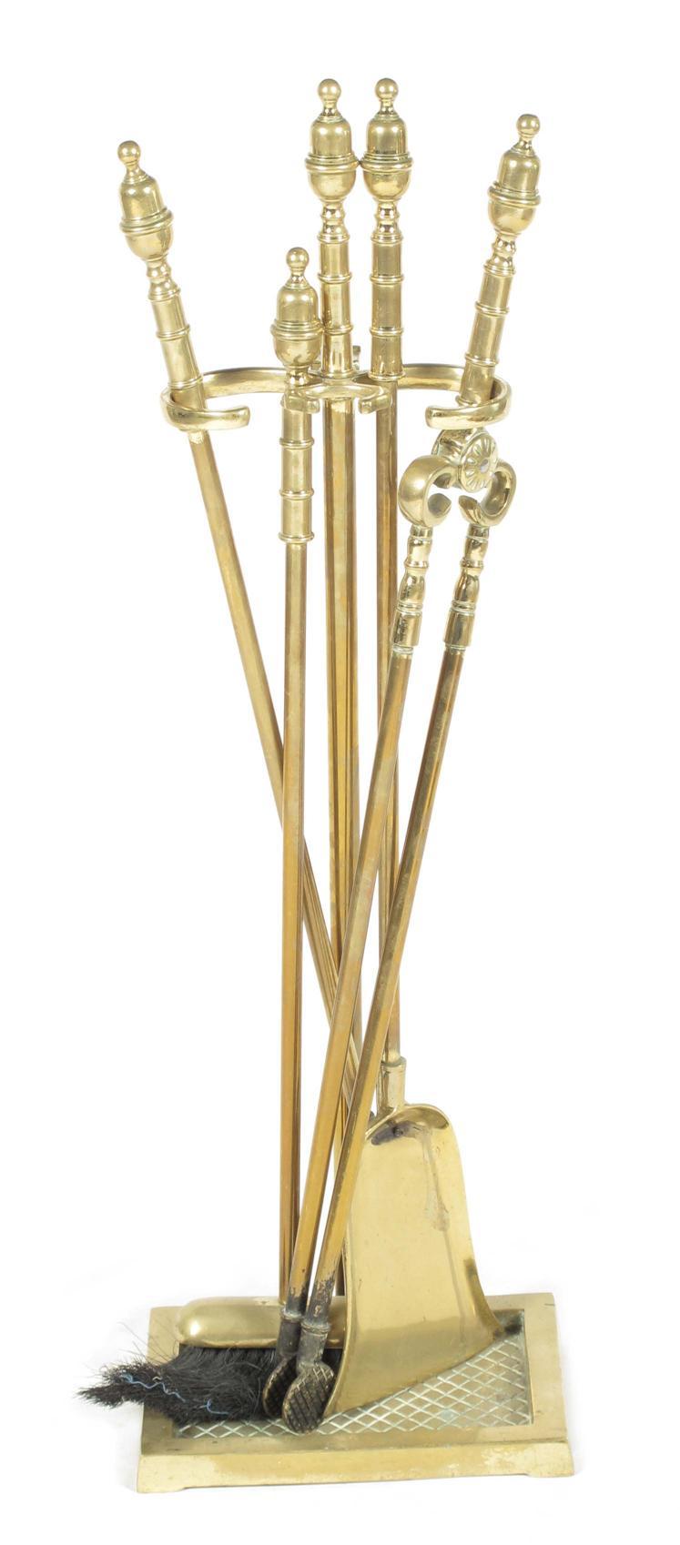 Appraisal: A brass four piece fire companion set on stand