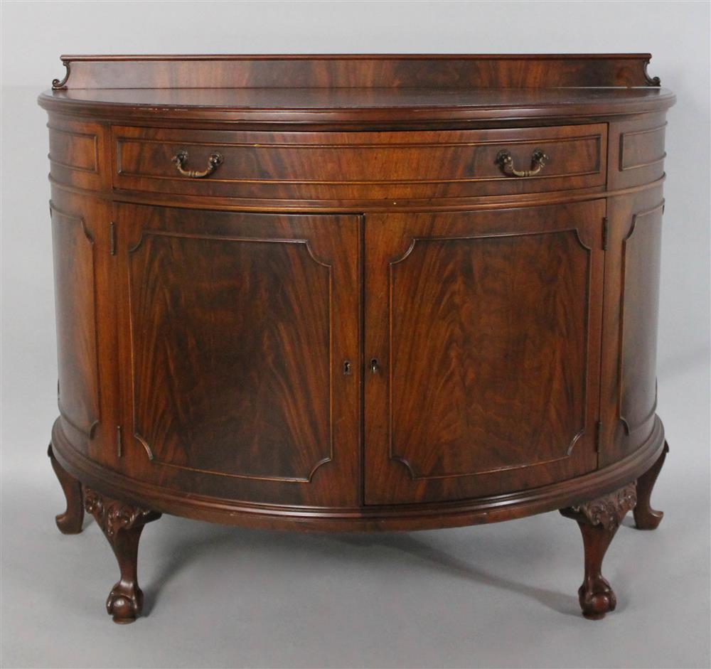 Appraisal: QUEEN ANNE STYLE MAHOGANY DEMILUNE CABINET in the English taste