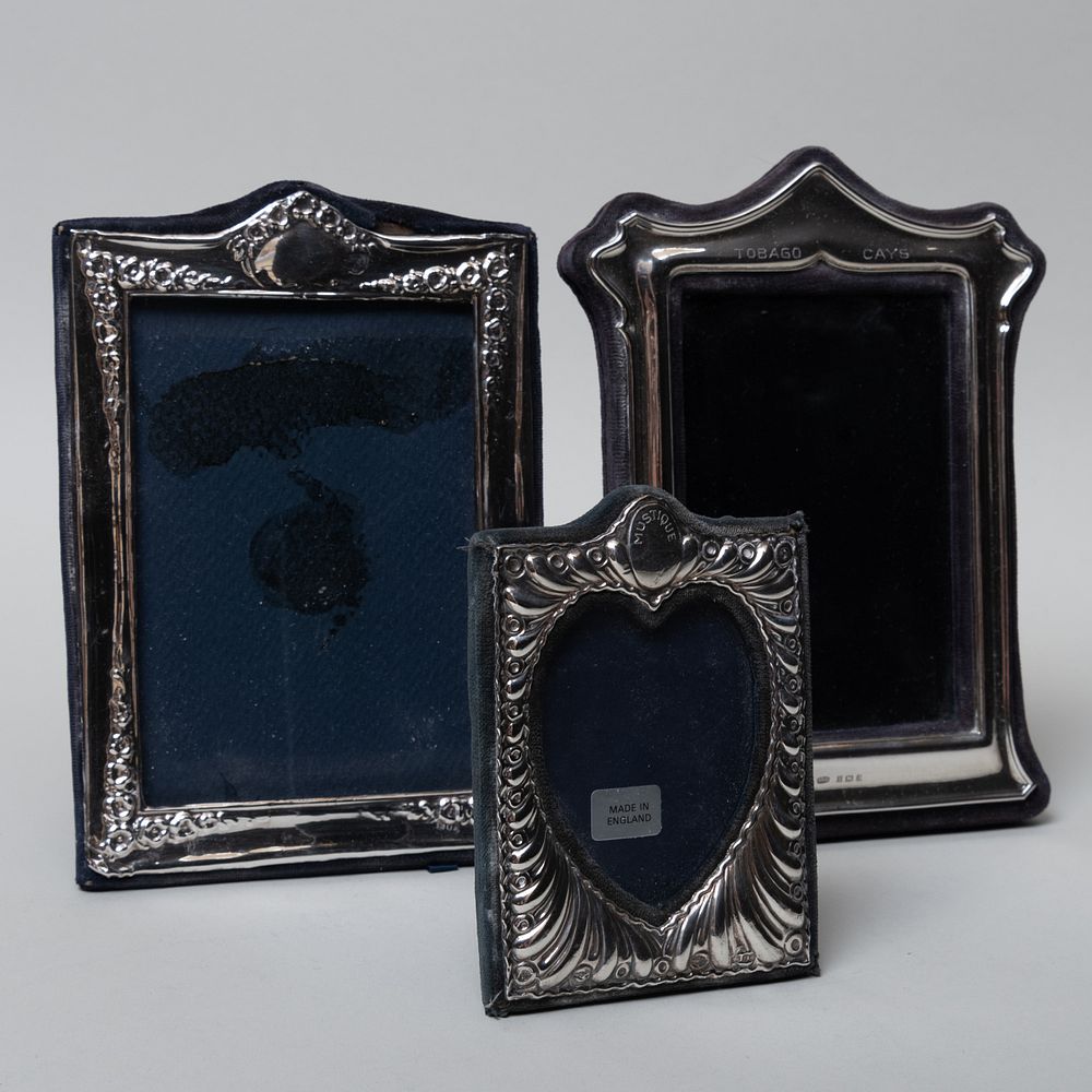 Appraisal: Group of Three English Silver Frames Comprising A silver-mounted velvet