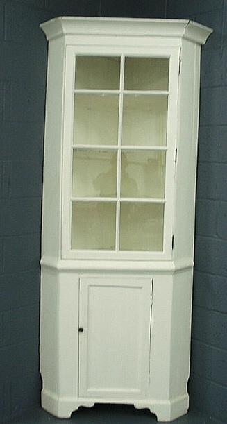 Appraisal: Pine one-piece corner cupboard early th c painted white with