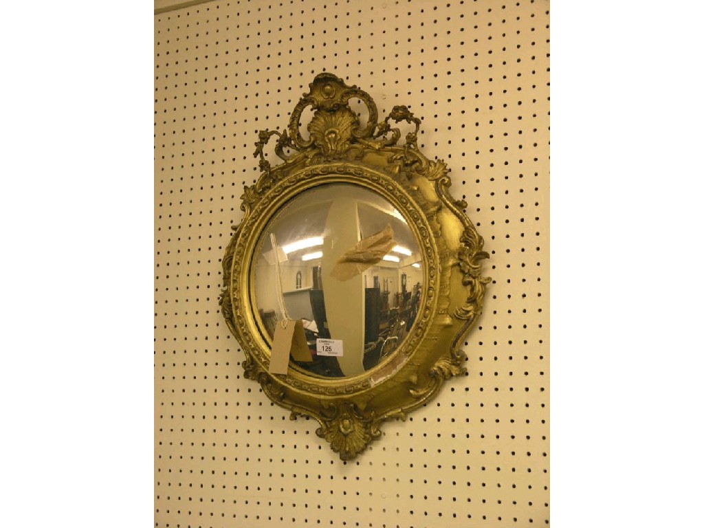 Appraisal: A th century convex mirror gilt frame moulded with shell