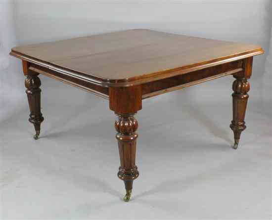 Appraisal: A Victorian mahogany extending dining table with two spare leaves