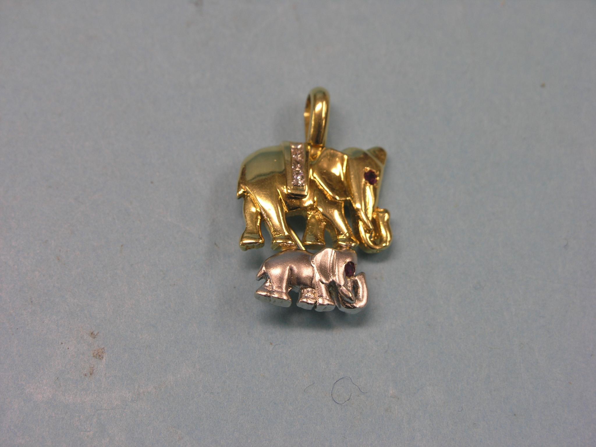 Appraisal: A modern ct gold elephant pendant-brooch set four small diamonds