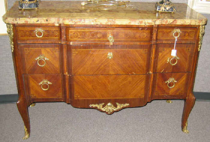 Appraisal: FRENCH MARBLE TOP MARQUETRY COMMODE Shaped marble top resting on