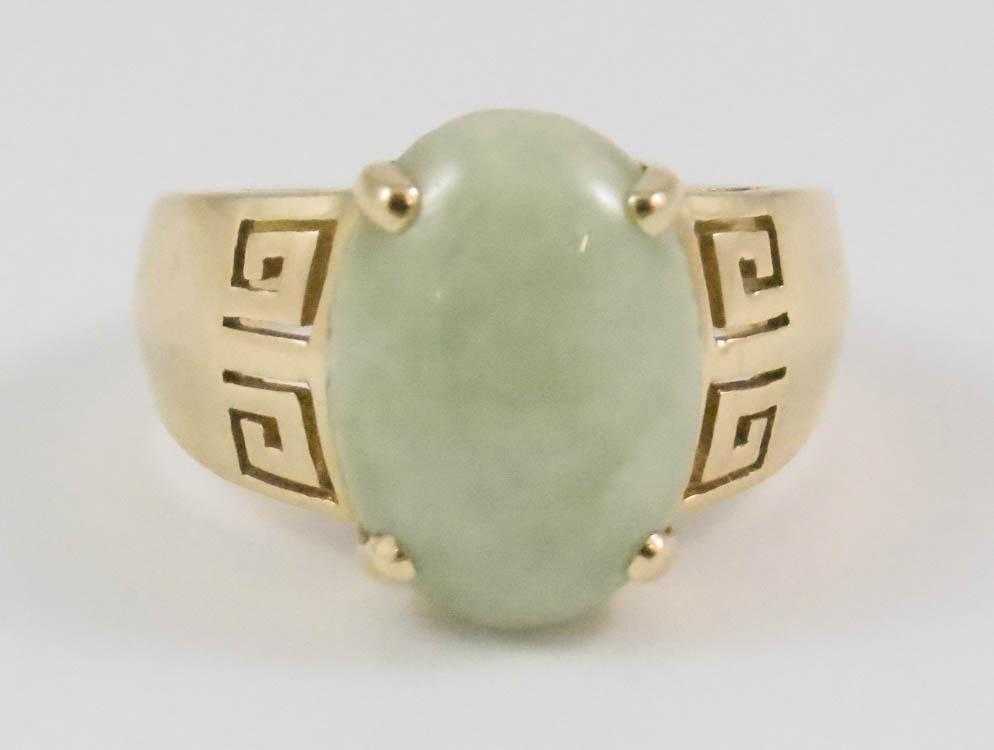 Appraisal: CHINESE JADE AND FOURTEEN KARAT GOLD RING centering an oval