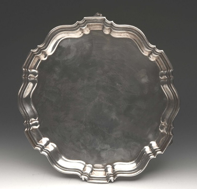 Appraisal: A SILVER SALVER of circular form with pie-crust border and