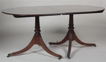 Appraisal: A Regency style mahogany twin pedestal dining table the readed